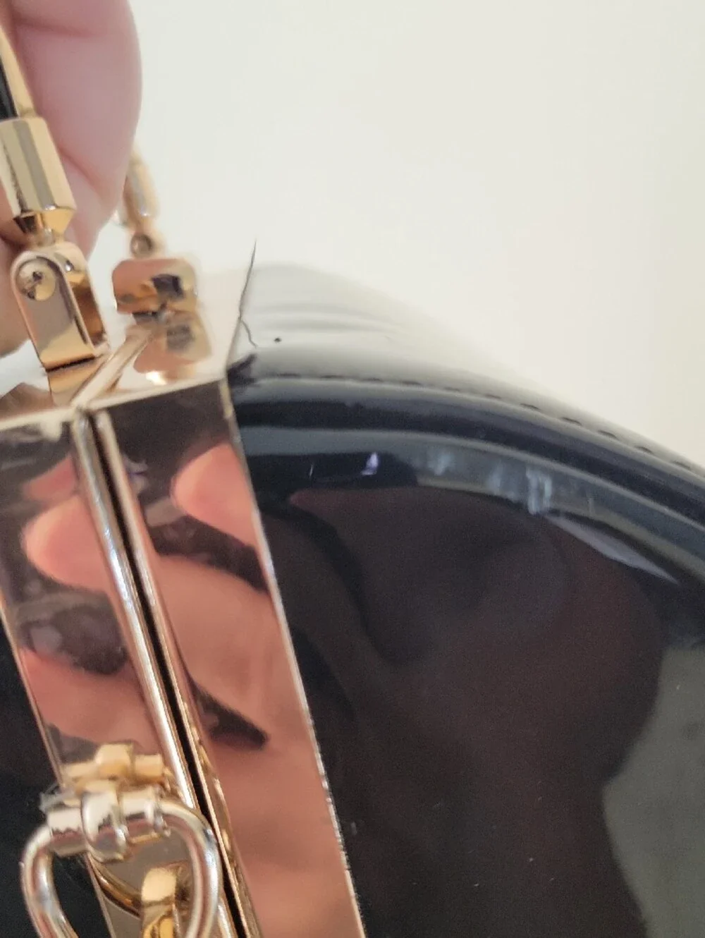 Vintage Sleek Black Patent Barrel Crossbody Bag with Gold Hardware